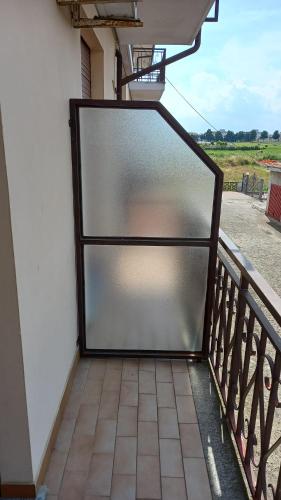 a large screen door on the side of a balcony at La Terrazza in Cherasco