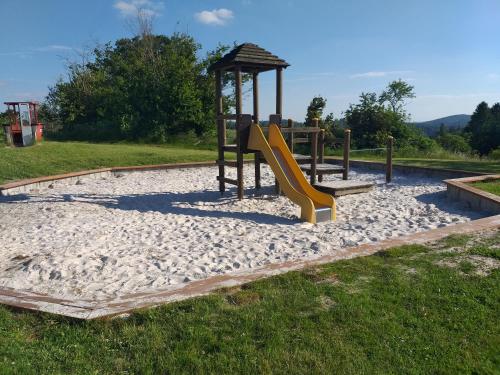 a playground with a slide at App 342 gemütlich und mit Weitblick in Braunlage