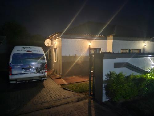 a van parked in front of a house at night at Buffalo guest lodge in Bushbuckridge