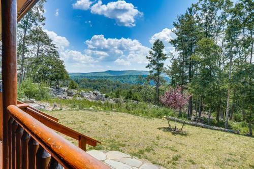 a view from the deck of a cabin with a view of the mountains at Secluded Mountain Cabin in Wardensville! in Wardensville