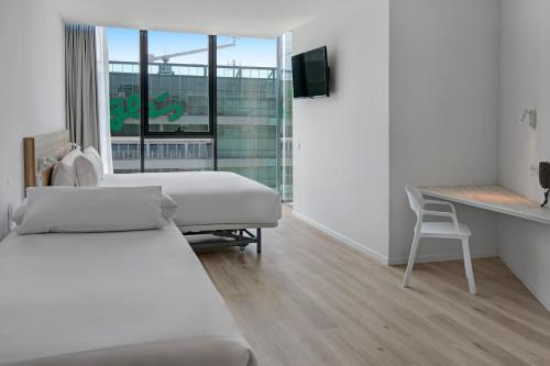 Ένα ή περισσότερα κρεβάτια σε δωμάτιο στο B&B HOTEL Porto Gaia