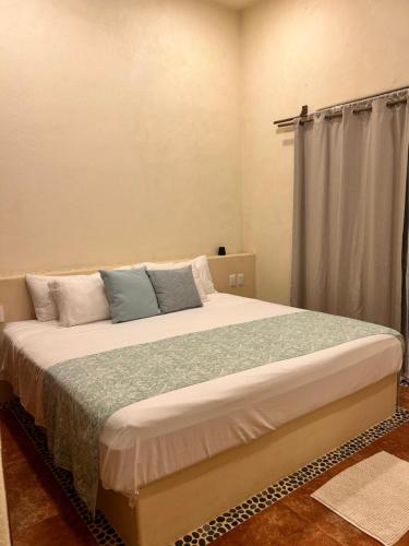 a bedroom with a large bed in a room at A Son de Mar - Playa Las Gatas acceso por mar in Zihuatanejo