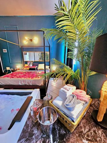 a bedroom with a bed and a table with towels at AMA Esclusive SPA Amore in Ferrara
