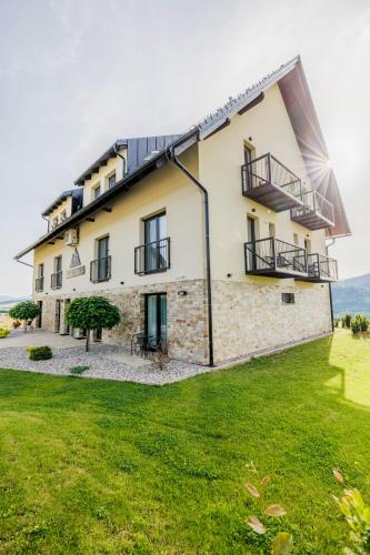 an external view of a house with a lawn at HP APARTMÁNY SKIAREÁL- Buková Hora v Orlických horách 100 m od lanovky in Červená Voda