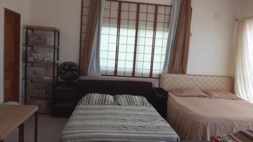 Katil atau katil-katil dalam bilik di Triplex beach house