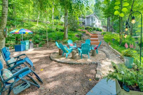 a group of chairs and a table in a yard at Creekside Hendersonville Haven Hot Tub and Fire Pit in Hendersonville