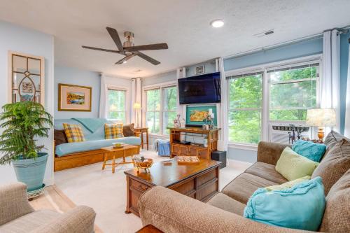 a living room with two couches and a tv at Creekside Hendersonville Haven Hot Tub and Fire Pit in Hendersonville