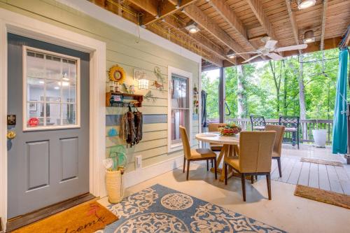 a dining room with a table and chairs at Creekside Hendersonville Haven Hot Tub and Fire Pit in Hendersonville