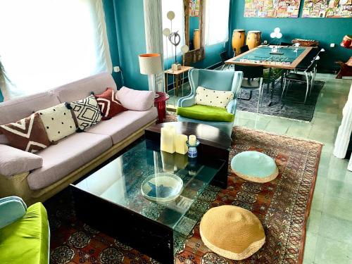 a living room with a couch and a table at Carmen Guillemot in Alcanar