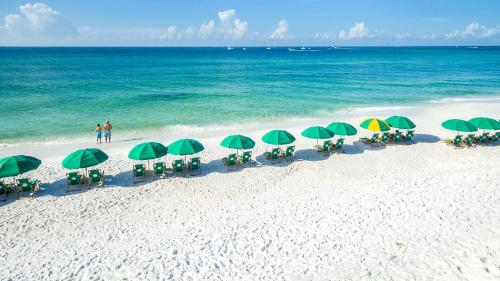 an overhead view of a beach with chairs and umbrellas at Joes Dream- by Holiday Isle Properties in Destin