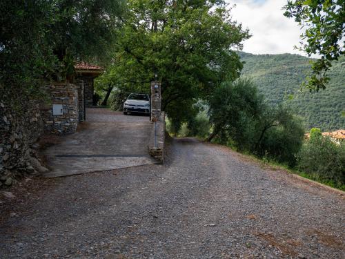 a road with a car parked on the side at Agri Borgata Vallone - Apartments - by HOST4U in Lecchiore