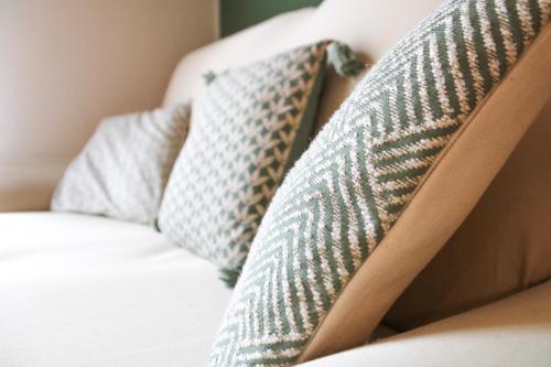 a close up of two pillows on a couch at Appartamento Val Da Rin - Vista sulle Tre Cime in Auronzo di Cadore