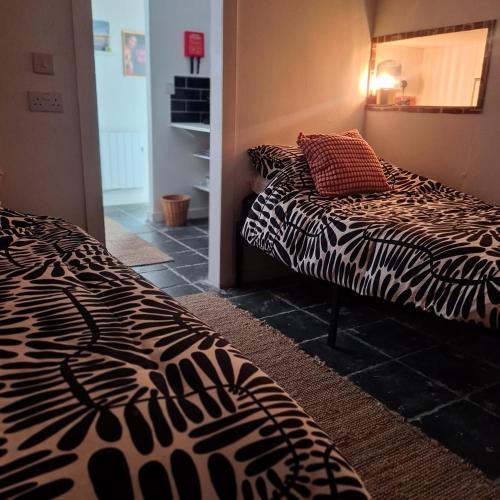 Postel nebo postele na pokoji v ubytování Zebra Lodge