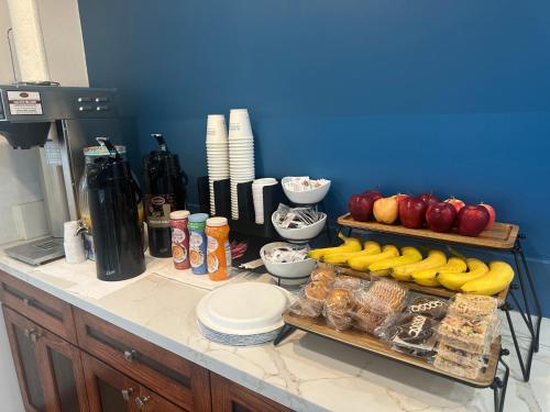 a kitchen counter with a bunch of food on it at Super 8 by Wyndham Oceanside Downtown in Oceanside