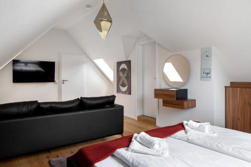 a living room with two beds and a couch at Skylodges in Oberried