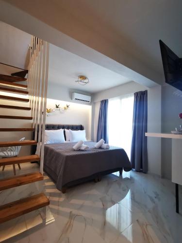 a bedroom with a bed and a large window at Luxury Villa Anna Marittima in Limenas