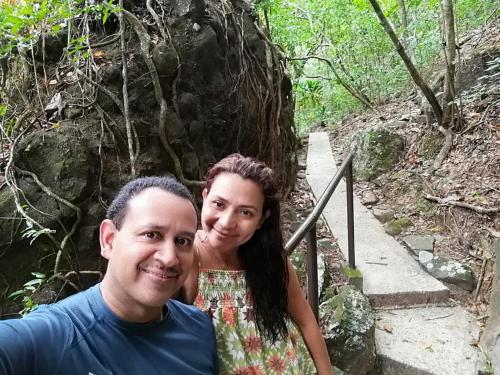 a man and a woman posing for a picture on a trail at Exclusive Altos del Maria 2 Bedroom Apartment-Private Pool & Mountain Views in Sorá