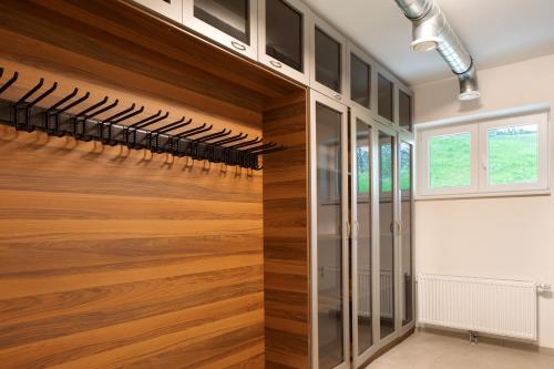 a wine cellar with a wooden wall with wine racks at Skylodges in Oberried