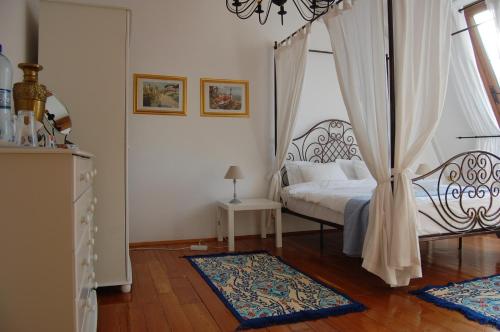 a bedroom with a bed with a canopy at Bucharest Boutique Accommodation by Hotels in Bucharest