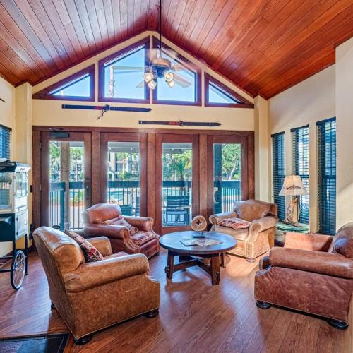 a living room with leather chairs and a table at Family home near USF in Tampa