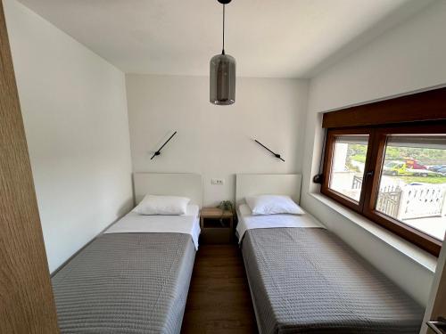 Katil atau katil-katil dalam bilik di APARTMANI 4 PALME