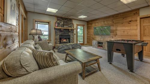 a living room with a couch and a table with a chessboard at An Owl's Perch in Morganton