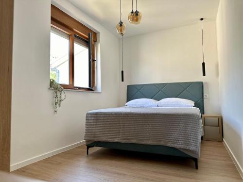Katil atau katil-katil dalam bilik di APARTMANI 4 PALME