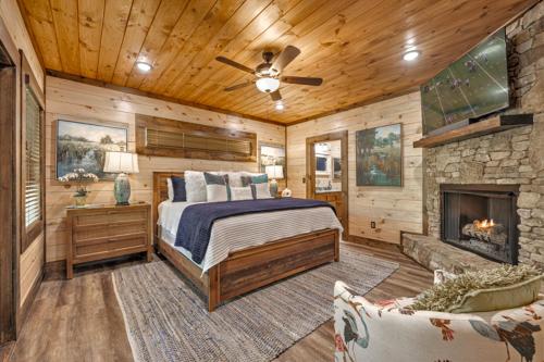 a bedroom with a bed and a fireplace at Friends in High Places in Blue Ridge