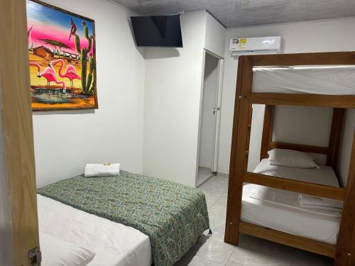 Postel nebo postele na pokoji v ubytování Hostal mayapo confort
