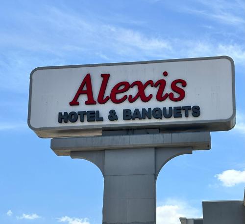 a sign for a hotel and banquets at Alexis Hotel & Banquets Dallas Park Central Galleria in Dallas