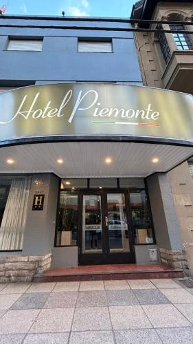 a hotel programme sign on the front of a building at Piemonte in Mar del Plata