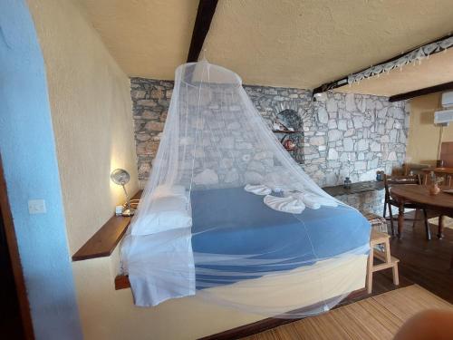 En eller flere senge i et værelse på Elma's Houses - Terrace Studio Aliki