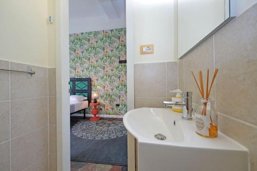 a bathroom with a sink and a shower at Colosseo Kokedama rooms in Rome