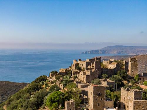 an old village on a hill near the ocean at Kassis Mansion in Páliros