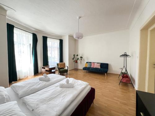 a large room with two beds in it at Arch Apartment in Třebíč in Třebíč