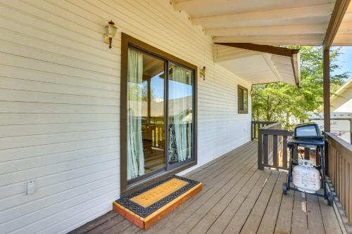 a porch with a grill on the side of a house at Hike and Golf Family Home with Deck in Payson! in Payson