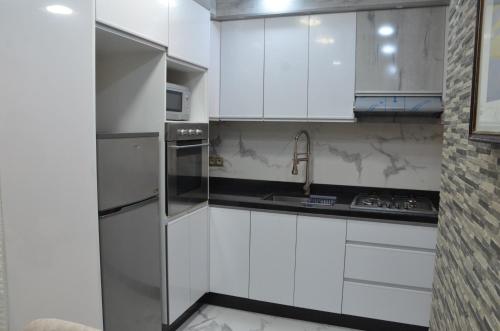 Kuchyň nebo kuchyňský kout v ubytování Appartement de standing familiale à Agadir