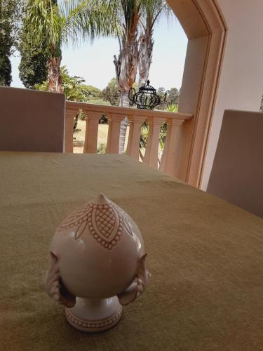 a white vase sitting on top of a table at Relais LaValle in Taranto