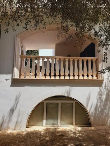 a building with a window and a balcony at Relais LaValle in Taranto