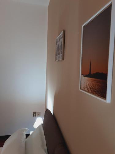 a living room with a couch and a picture on the wall at Relais LaValle in Taranto