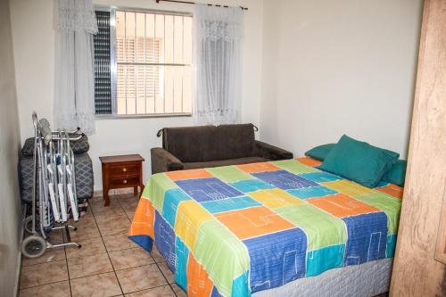 Ένα ή περισσότερα κρεβάτια σε δωμάτιο στο Apto Praia Grande (Guilhermina)