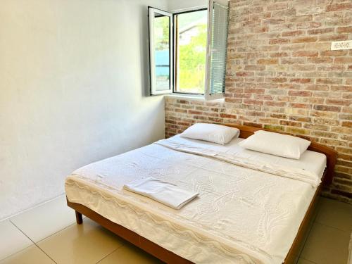 Ein Bett oder Betten in einem Zimmer der Unterkunft Apartments Simovic