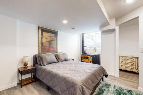 a bedroom with a bed and a painting on the wall at Stucco House in North Hudson