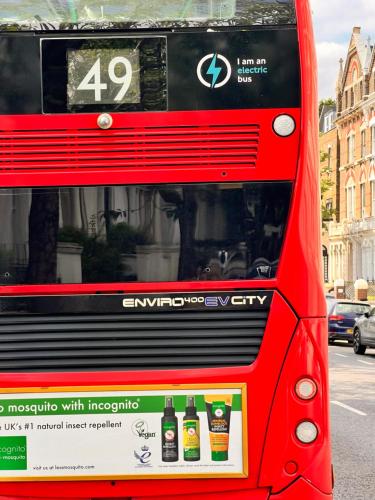 a red bus with bottles on the back at Holland Inn Hotel in London