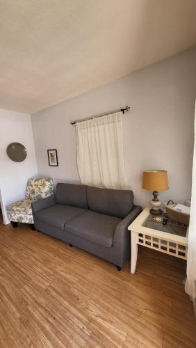 a living room with a couch and a table at Unit 5 - Stay at Roosevelt Row Modern 2BR 2BA Condo in Phoenix