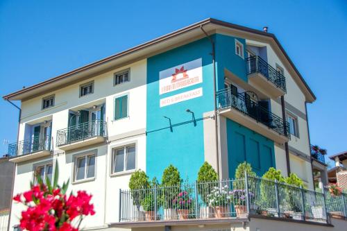 a building with blue paint on it at I Fiori di Margherita Luxury B&B in Perugia