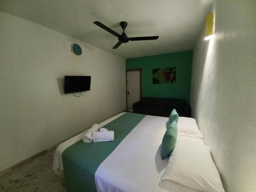 Ένα ή περισσότερα κρεβάτια σε δωμάτιο στο Hotel Casa Olga