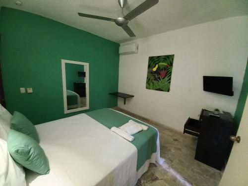 Ένα ή περισσότερα κρεβάτια σε δωμάτιο στο Hotel Casa Olga