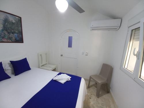 Ένα ή περισσότερα κρεβάτια σε δωμάτιο στο Hotel Casa Olga