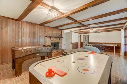 a room with a bed and a table with toys on it at Canopy Springs Game Room & Covered Outdoor Oasis in Colorado Springs
